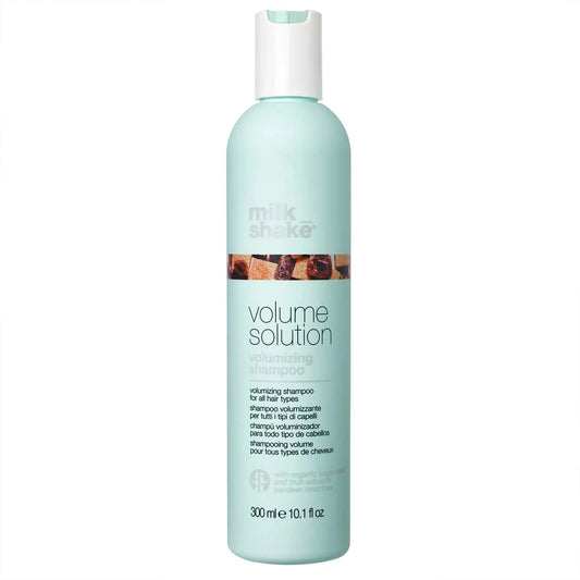 A light blue bottle of Milk_shake Volume Solution volumizing shampoo with grey and white text, shown against a plain white background.