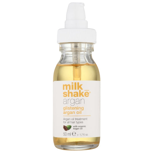 Milk Shake Argan Glistening Argan Oil, 50 ml bottle. A treatment oil for all hair types, enriched with organic argan oil. The bottle is clear with a white label and a white pump dispenser, containing a light golden-colored oil.