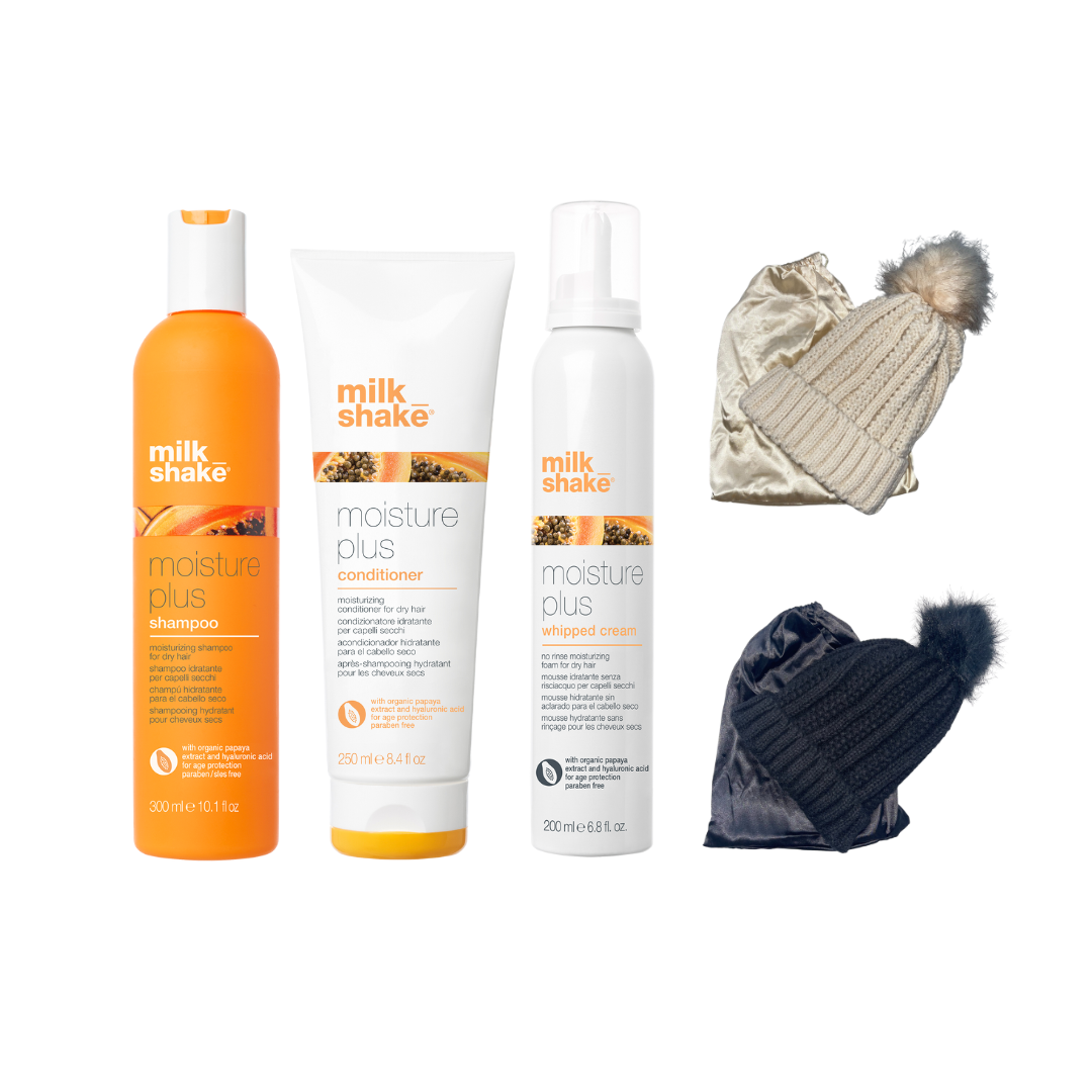 Milk Shake Gift Set including Moisture Plus shampoo, conditioner, and whipped cream, along with two beanie hats, one beige and one black, placed on a white background.