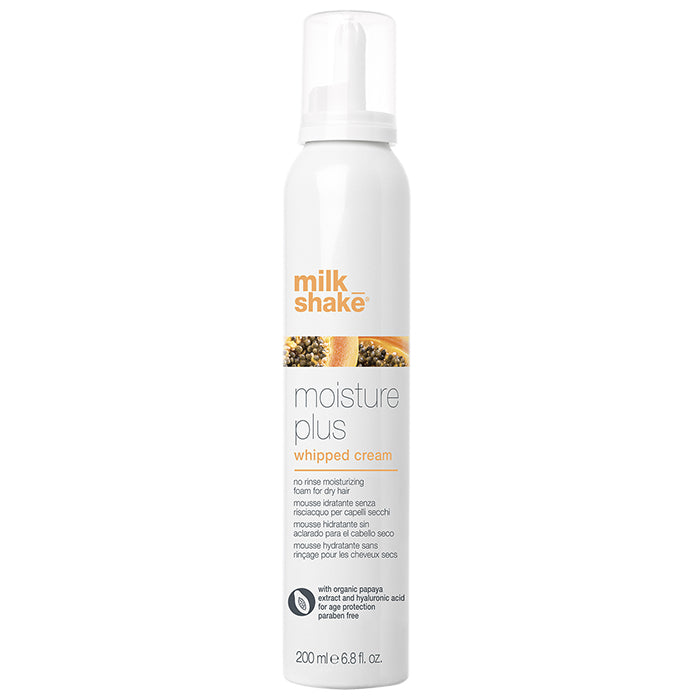 Milk Shake Moisture Plus Whipped Cream, 200 ml bottle. A no-rinse moisturizing foam designed for dry hair, enriched with organic papaya extract and hyaluronic acid. The bottle is white with orange branding and images of papaya.